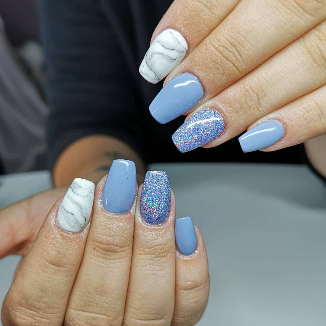 7. Soft Blue Marble and Glitter Short Nails - very short nail ideas