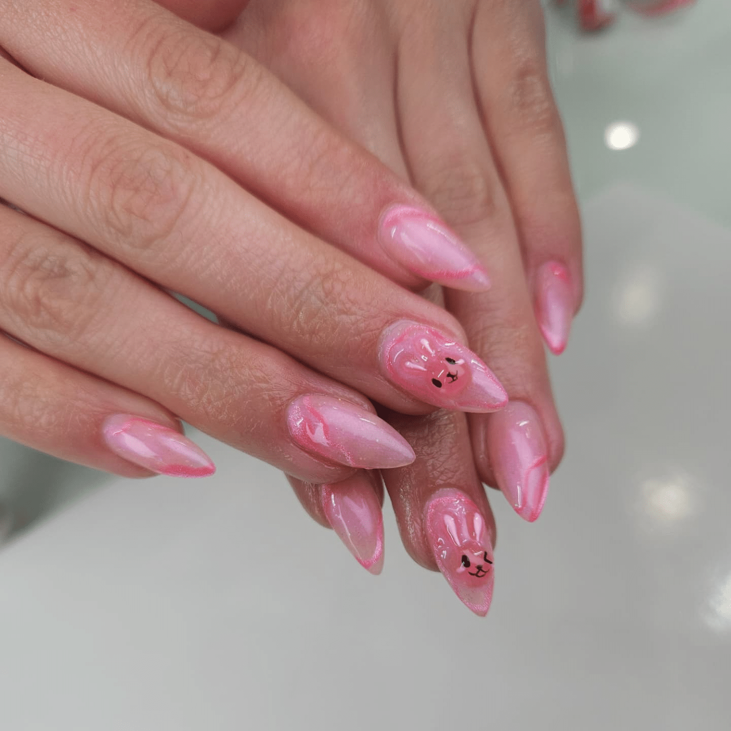 19. Sheer Pink Almond Nails with Cute Character Art - pink nail ideas
