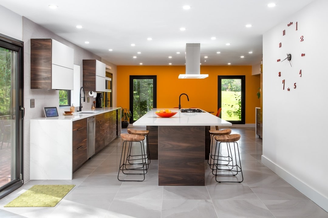 1. Bright Modern Kitchen with Orange Accent and Walnut Finishes - big kitchen ideas