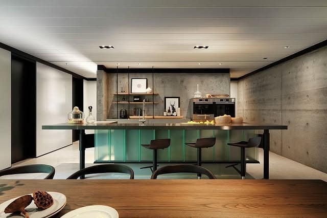 2. Industrial Concrete Kitchen with Dark Wood and Ambient Lighting - big kitchen ideas