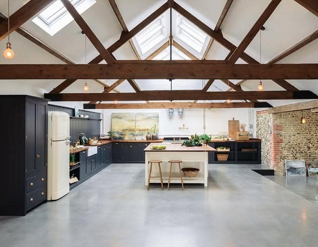 6. Rustic Modern Kitchen with Exposed Beams and Navy Cabinets - big kitchen ideas