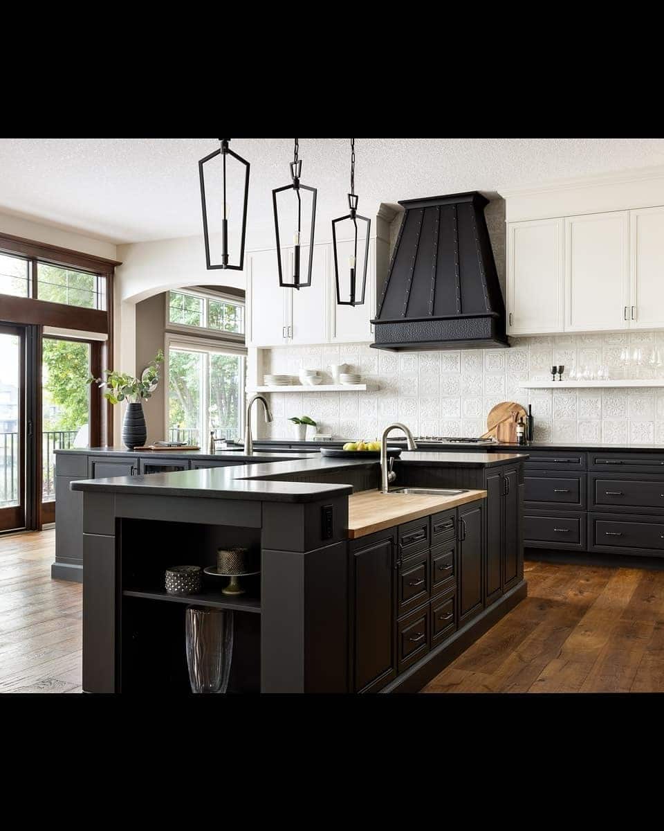 11. Classic Contrast Kitchen with Black Island and White Cabinetry - big kitchen ideas