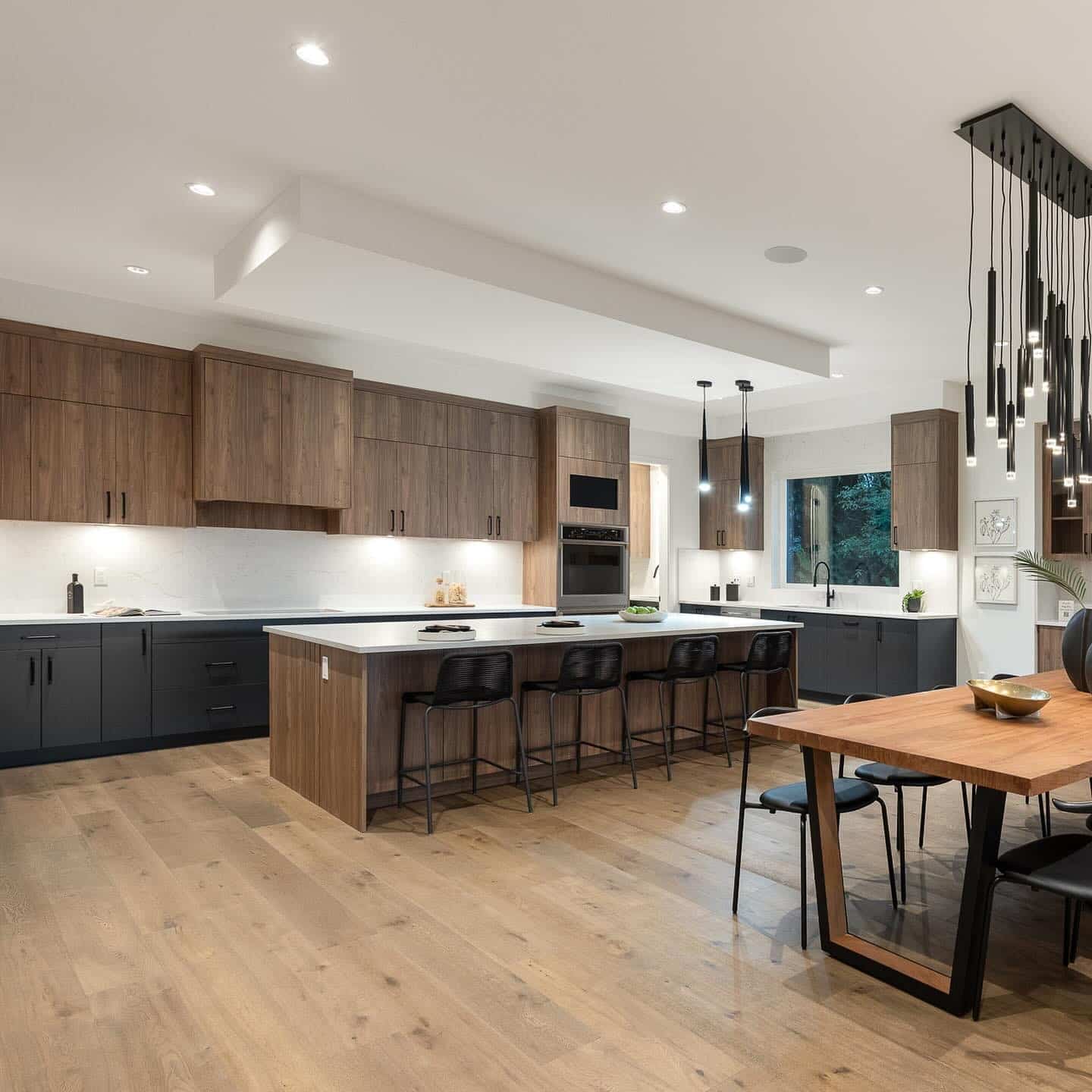 12. Contemporary Wood and Charcoal Kitchen with Oversized Island - big kitchen ideas