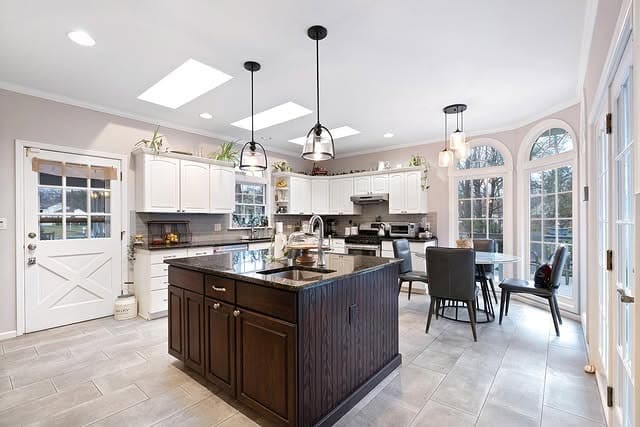 15. Transitional Kitchen with Dark Wood Island and Soft White Perimeter - big kitchen ideas