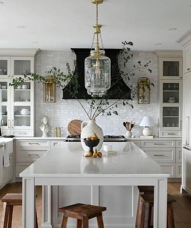 16. Elegant White Kitchen with Statement Glass Pendant and Black Range Hood - big kitchen ideas