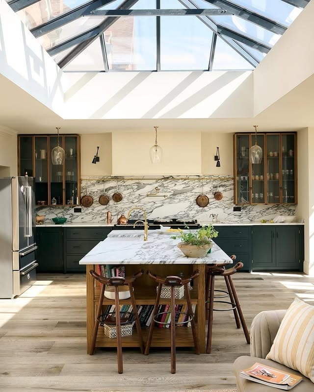 18. Skylit Kitchen with Marble Surfaces and Deep Green Cabinetry - big kitchen ideas