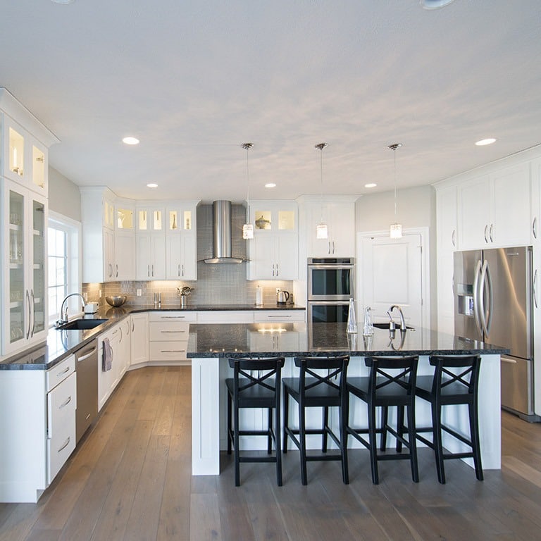 20. Bright White Kitchen with Black Accents and Classic Layout - big kitchen ideas