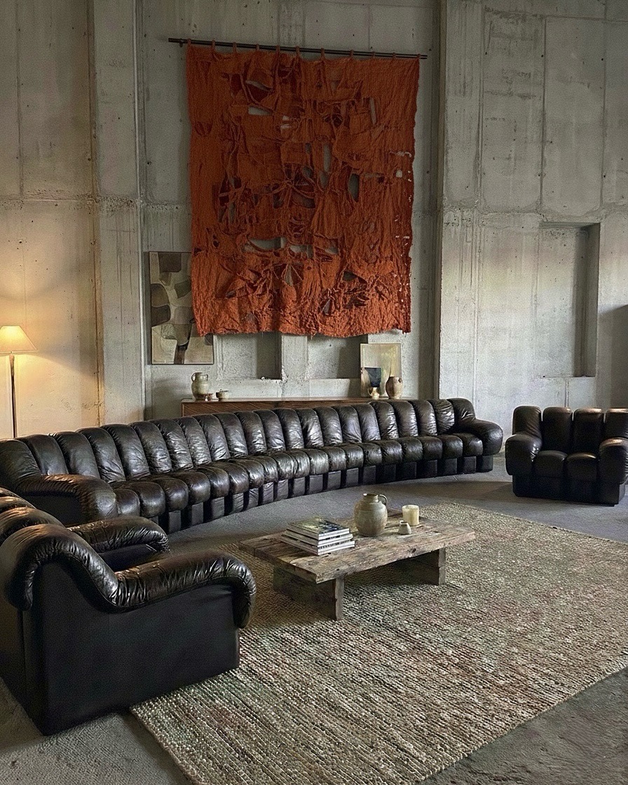 3. Deep Espresso Leather Sofa in Industrial-Inspired Loft - dark brown sofa living room ideas