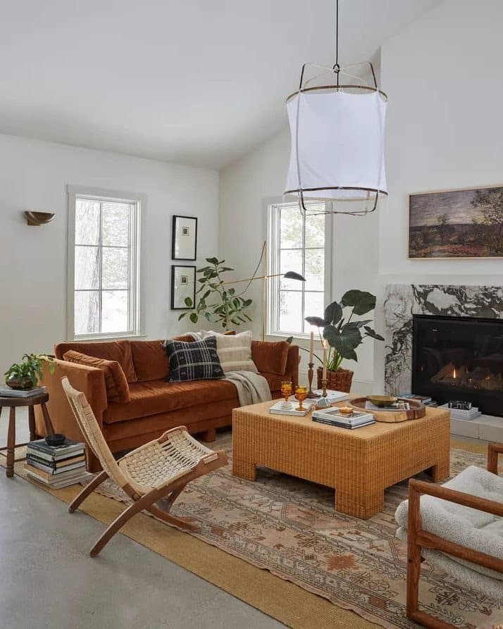 8. Classic Brown Sofa with Farmhouse Accents and Neutral Layers - dark brown sofa living room ideas