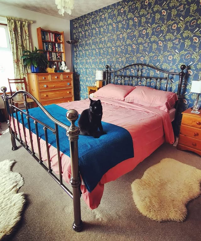 6. Bold Floral Wallpaper with Jewel-Toned Bedding - victorian bedroom ideas