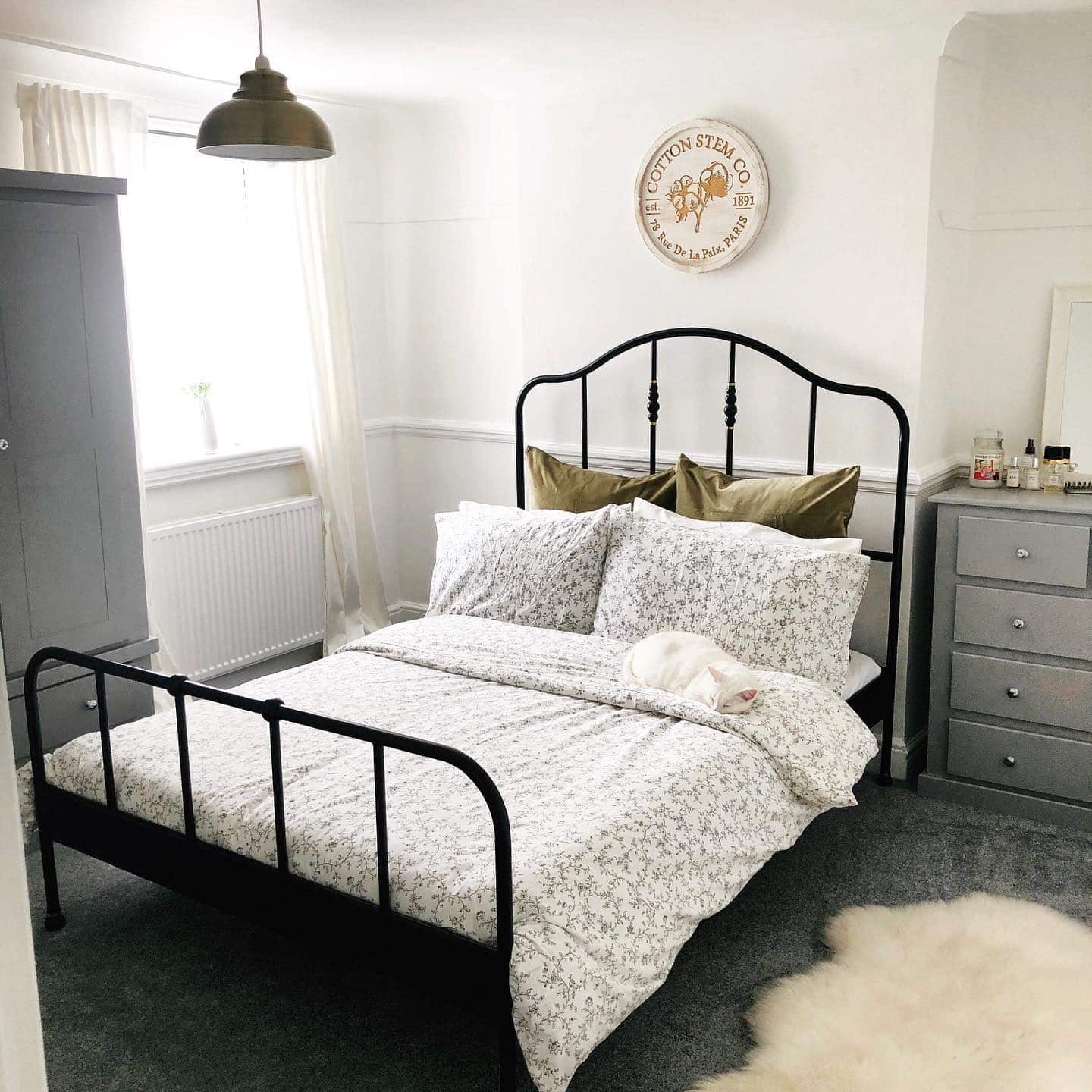 12. Classic White Victorian Bedroom with Black Iron Bed and Olive Accents - victorian bedroom ideas