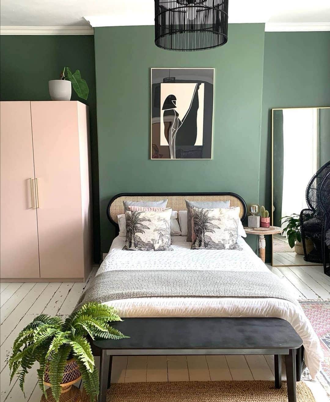 15. Green Statement Wall with Cane Headboard and Botanical Accents - victorian bedroom ideas