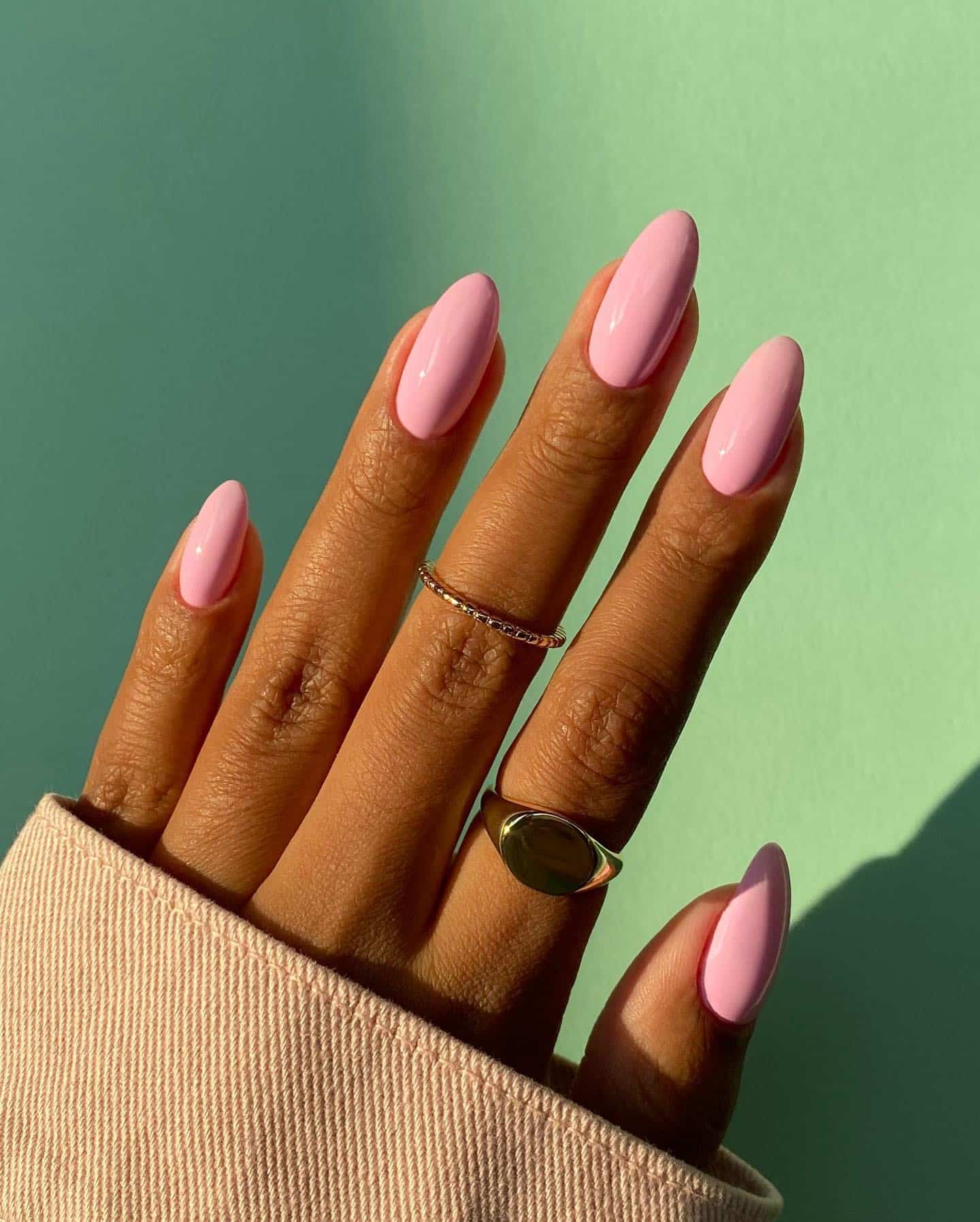 11. Glossy Baby Pink Almond Nails with Gold Rings Styling - baby pink nail ideas