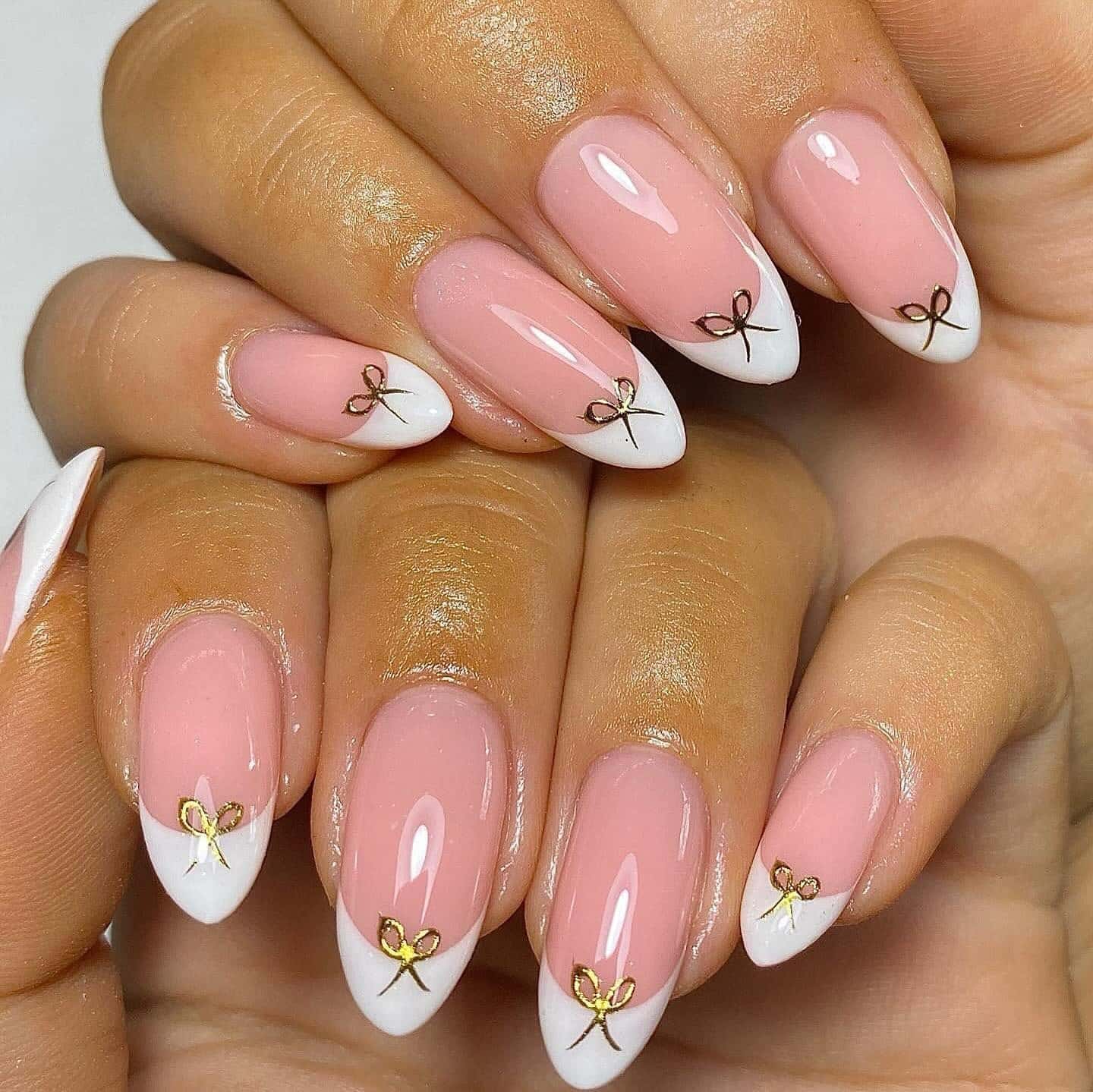 1. Soft Pink Almond French Tips with Gold Bow Accents - nail ideas with bows