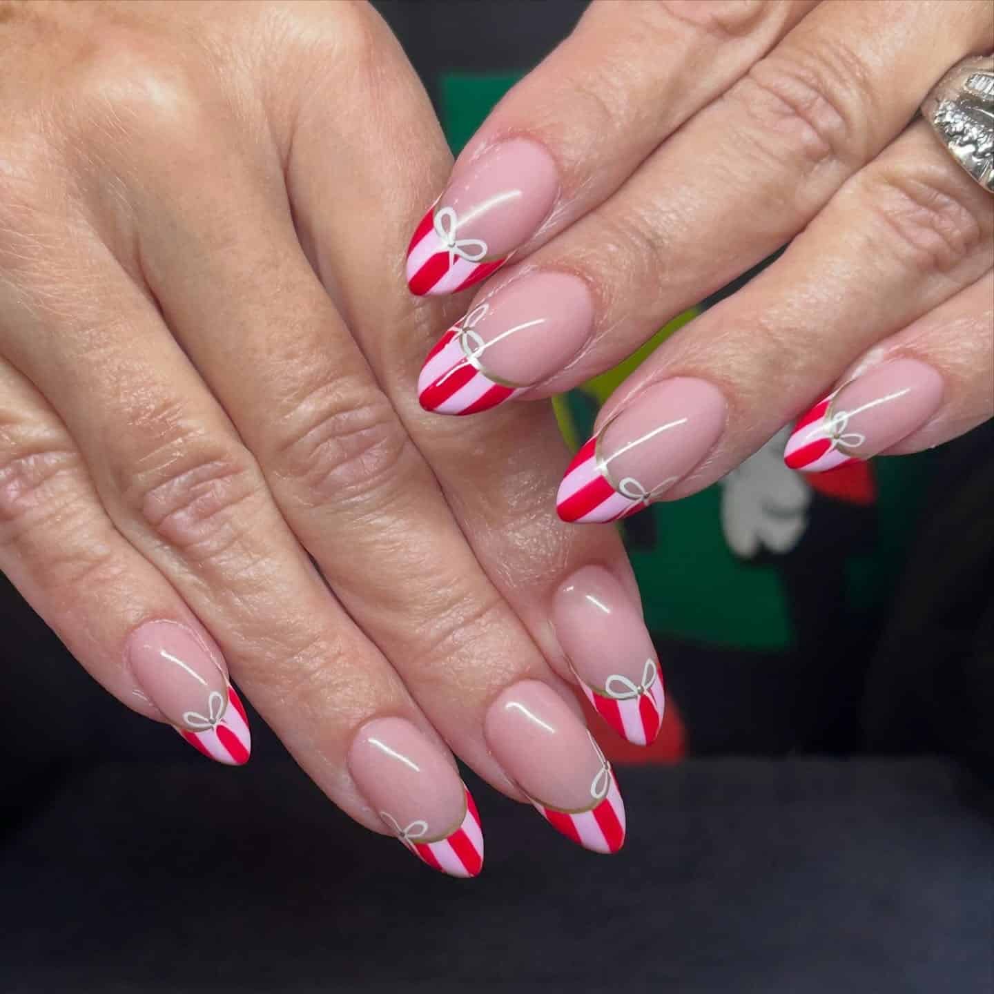 4. Candy Cane French Tips with Fine Bow Linework - nail ideas with bows