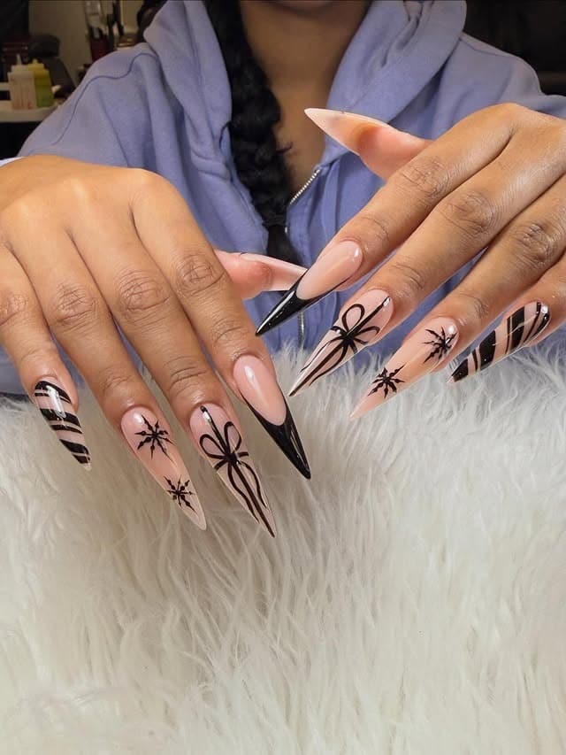 7. Nude Stiletto Nails with Black Bow and Stripe Art - nail ideas with bows