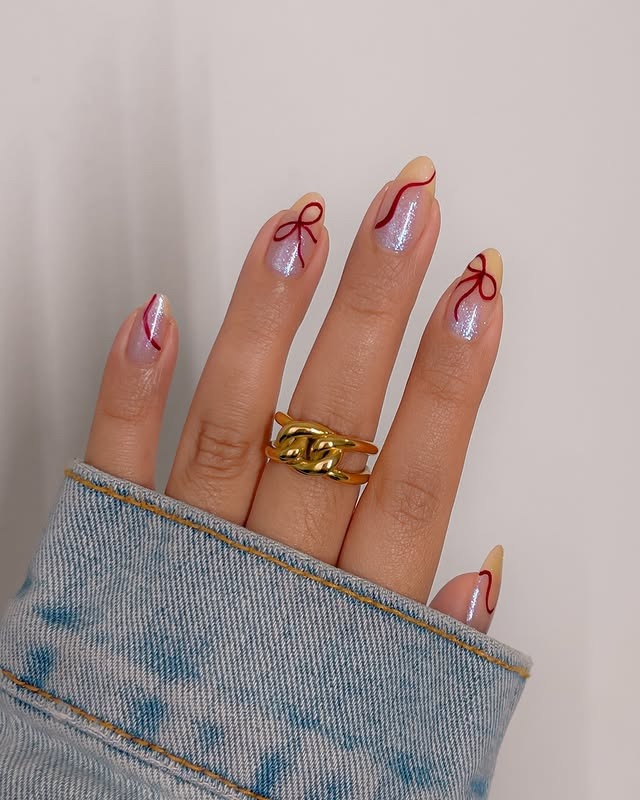 22. Iridescent Nude Almond Nails with Red Outline Tips and Bow Detail - nail ideas with bows