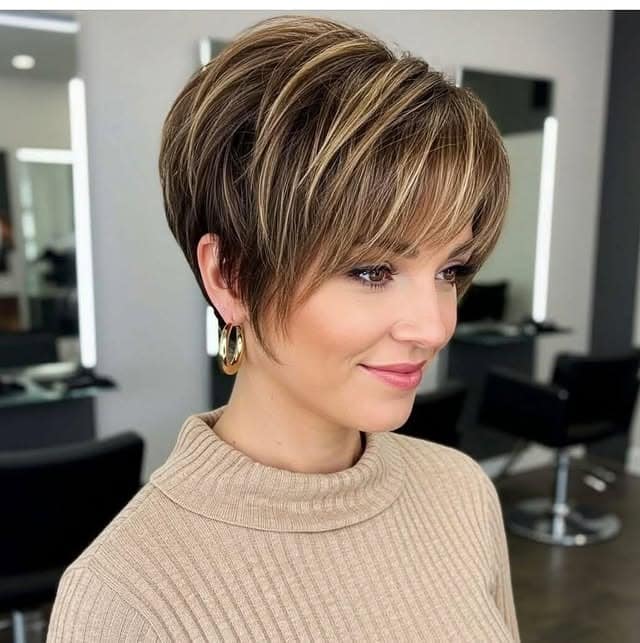 13. Highlighted Brunette Layered Pixie - Wispy Pixie Hairstyles
