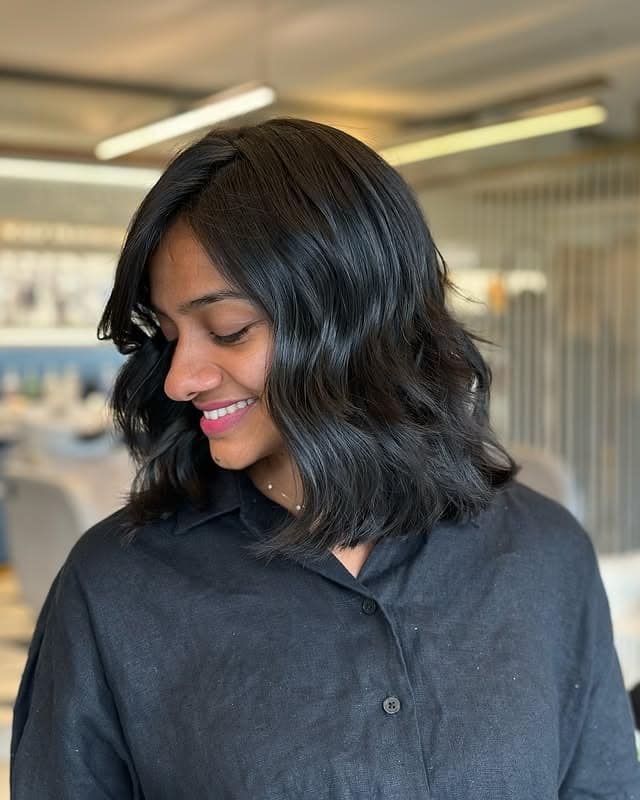 11. Glossy Soft Wave Bob with Natural Black Color - Tousled Bob Haircut