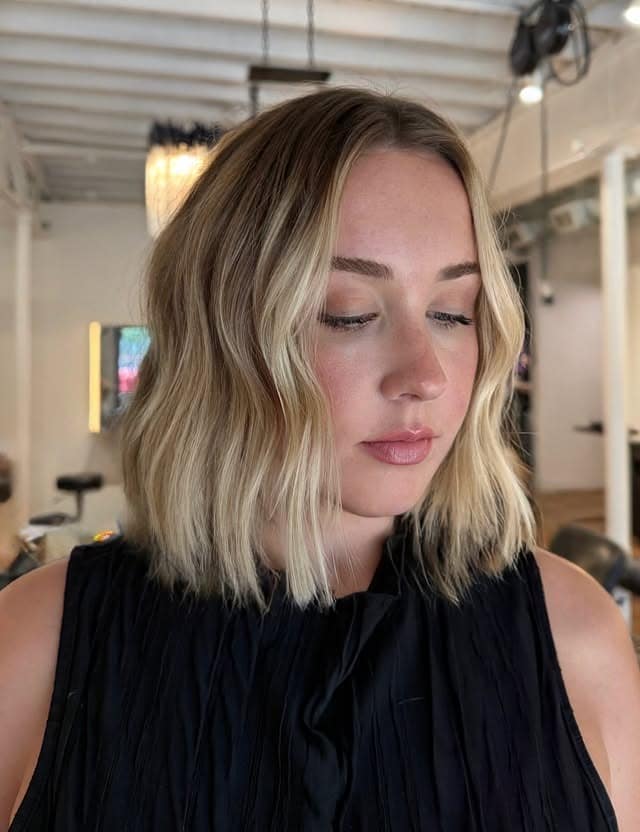 17. Rooted Blonde Bob with Face-Framing Brightness - Tousled Bob Haircut