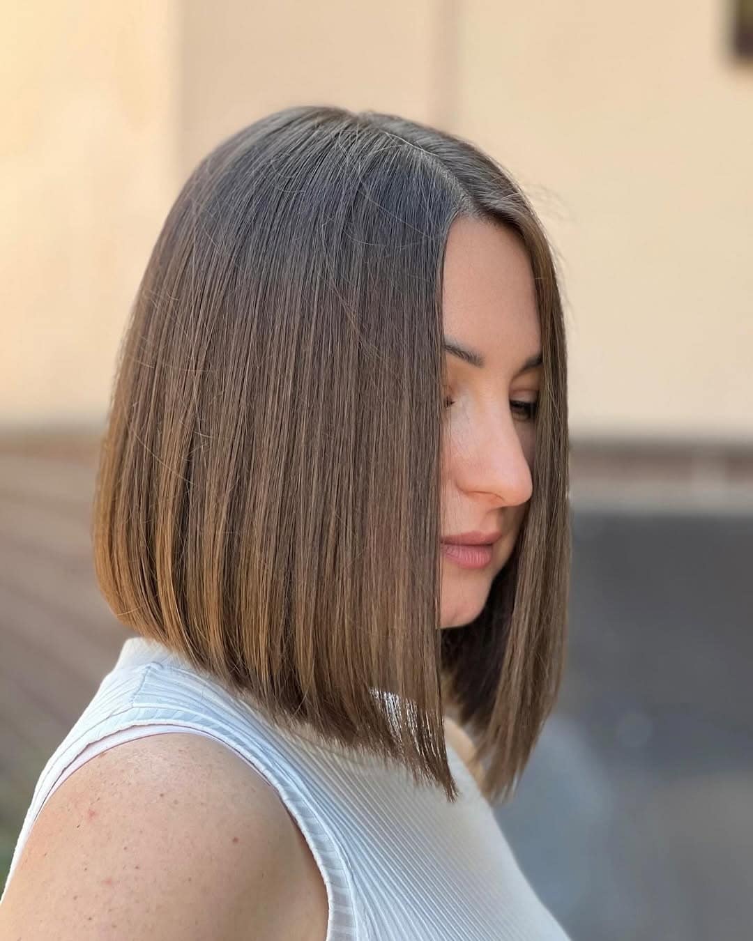 21. Sleek Blunt Bob with Cool Light Brown Finish - Tousled Bob Haircut