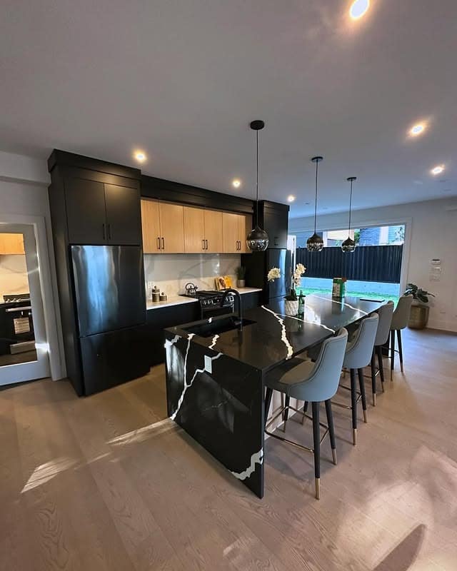 7. Luxe Black Kitchen with Marble and Wood Details - black and wood kitchen ideas