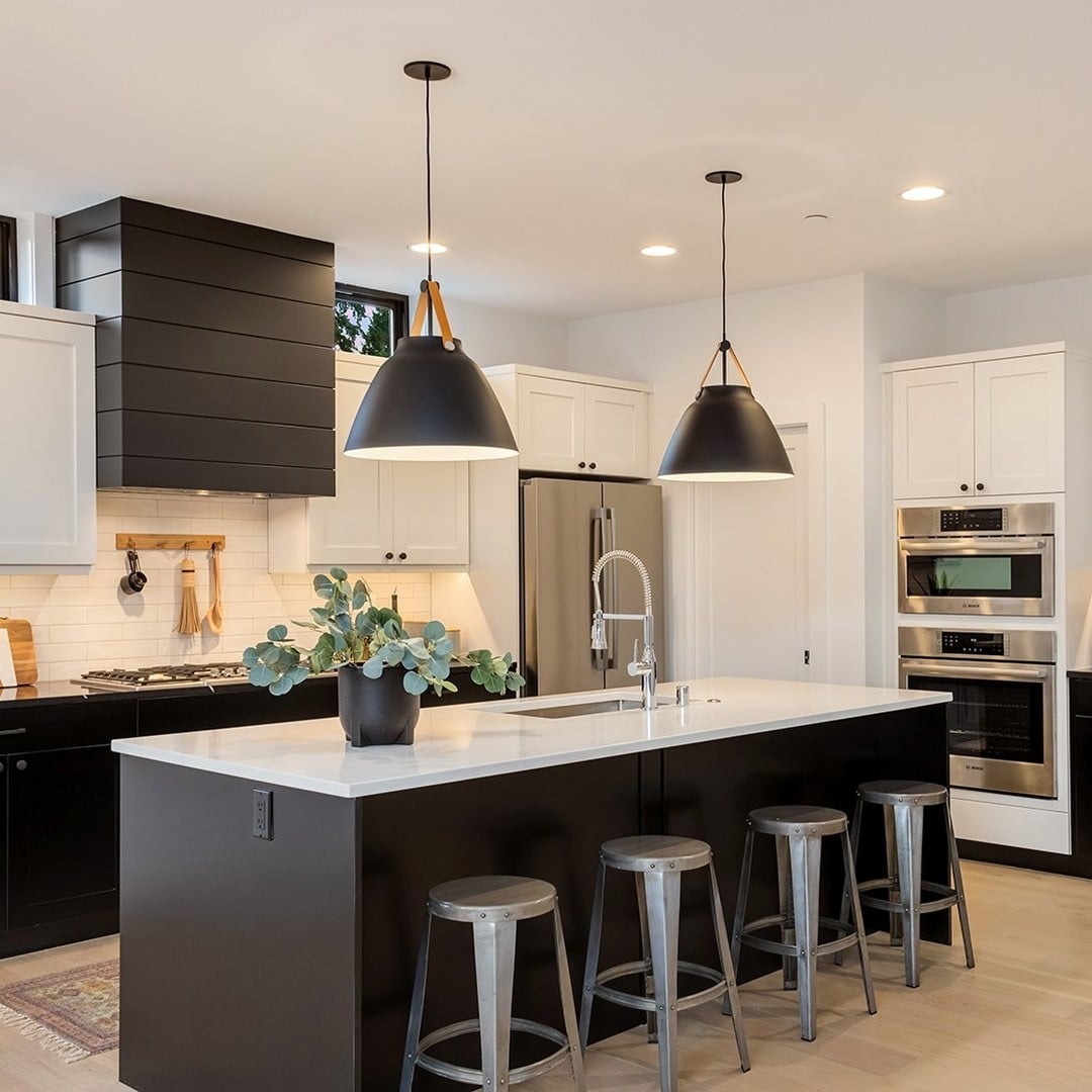 13. Black and White Kitchen with Wood Accents and Statement Pendants - black and wood kitchen ideas