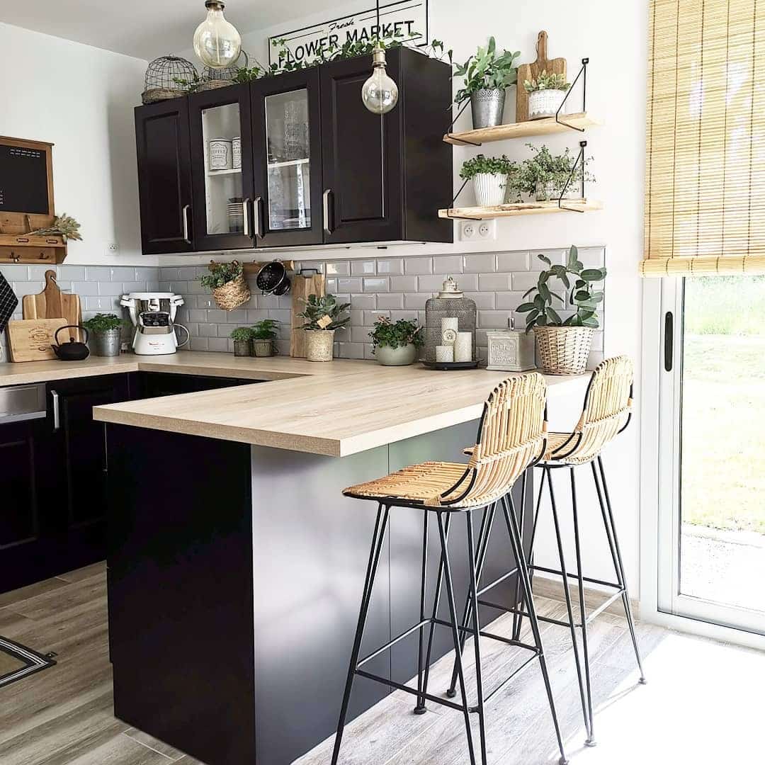 14. Farmhouse Black Kitchen with Light Wood Breakfast Bar - black and wood kitchen ideas