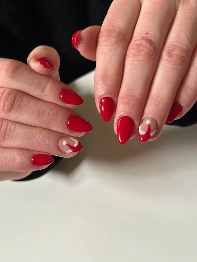 1. Glossy Cherry Almond Nails with Soft White Accent Art - red nail ideas