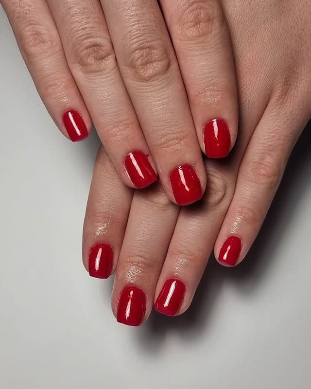 4. Short Square Red Nails with High-Gloss Finish - red nail ideas