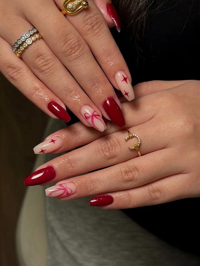 6. Red and Nude Almond Nails with Star and Bow Art - red nail ideas