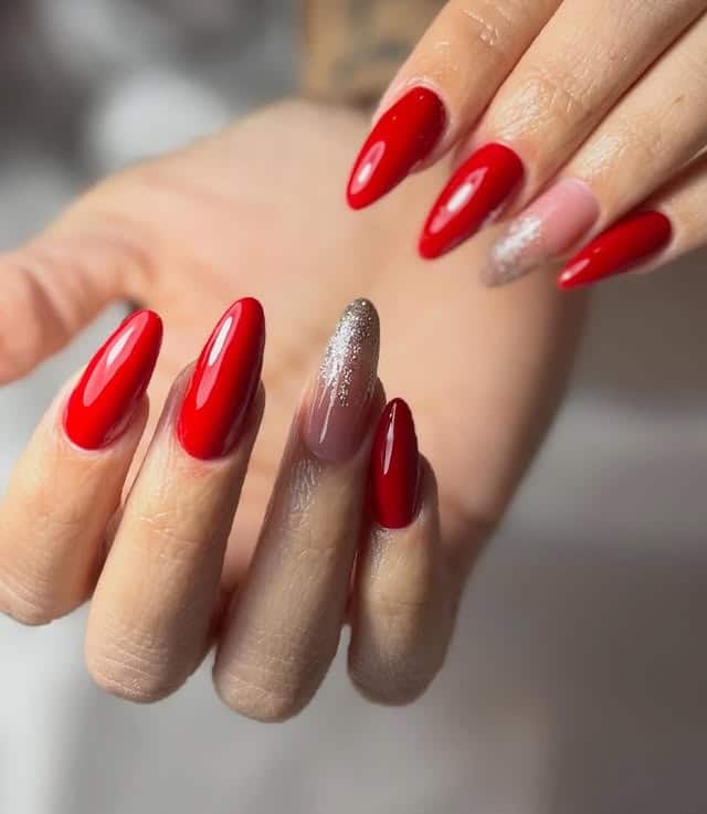 15. Red Almond Nails with Soft Glitter Accent Fade - red nail ideas