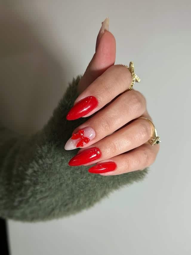 18. Red Almond Nails with 3D Bow Accent - red nail ideas