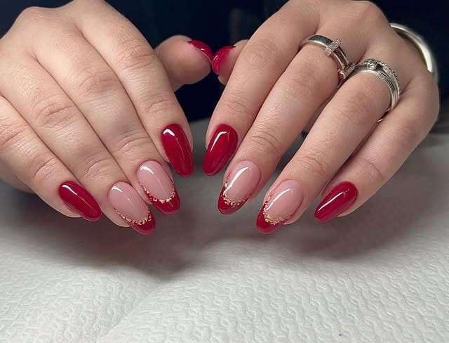 21. Red French Almond Nails with Gold Glitter Edges - red nail ideas