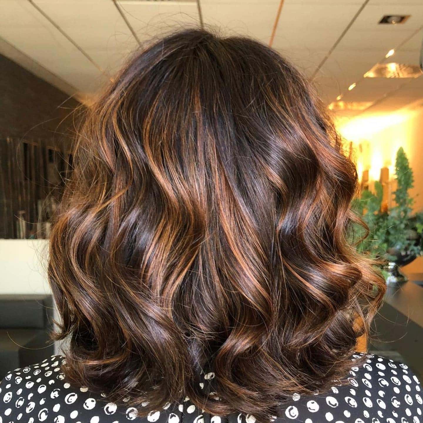 3. Rich Sandy Brown Glossy Waves - Sandy Brown Hair Color