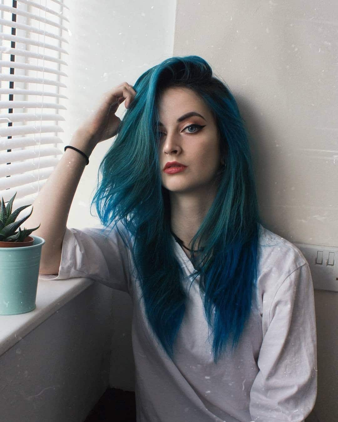 5. Teal-Blue Textured Medium Cut - Midnight Blue Hair Color