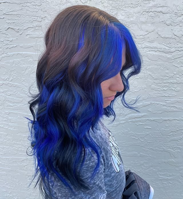 7. Midnight Blue Highlighted Waves on Brunette Base - Midnight Blue Hair Color
