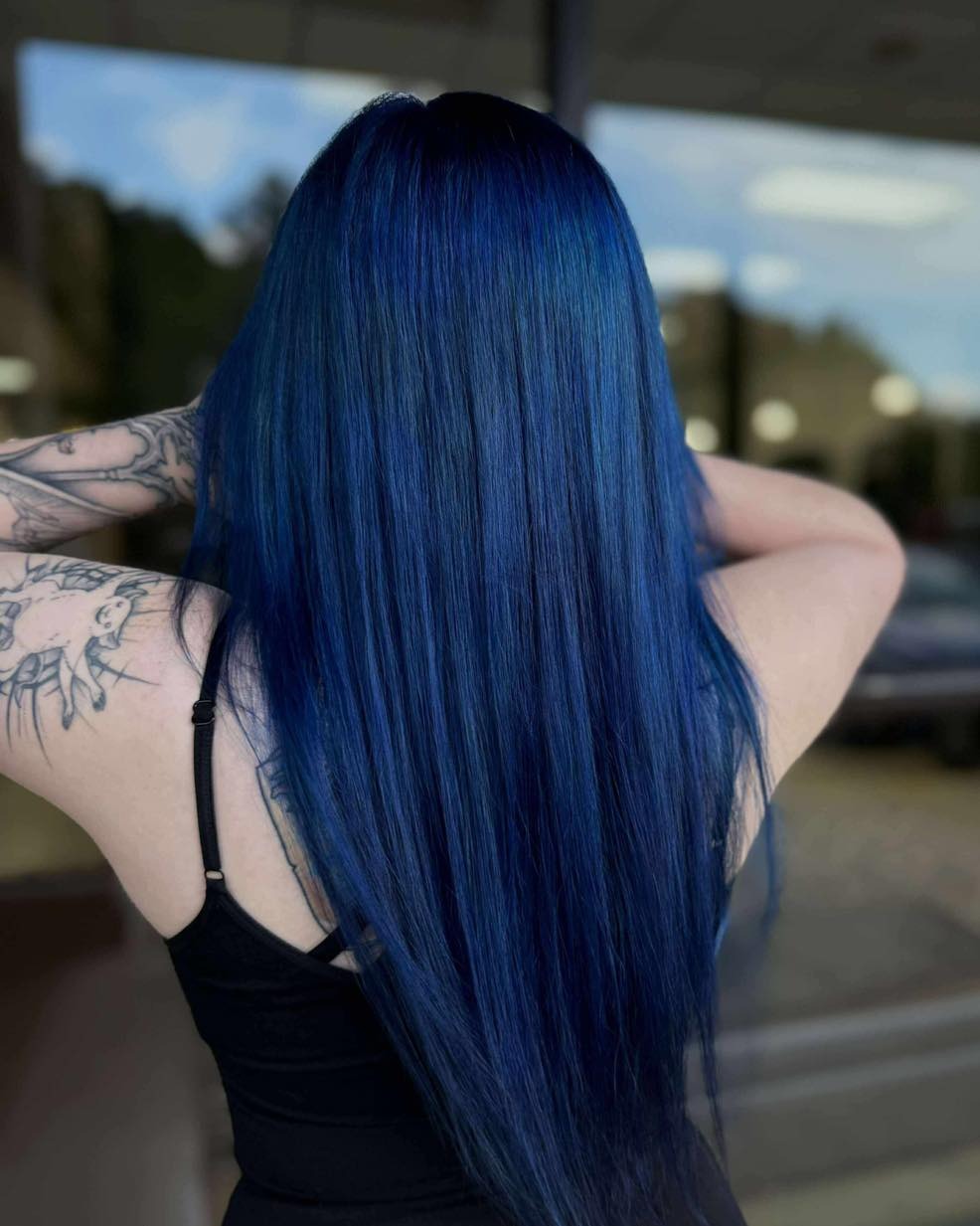 11. Sleek Midnight Blue Ultra-Long Layers - Midnight Blue Hair Color