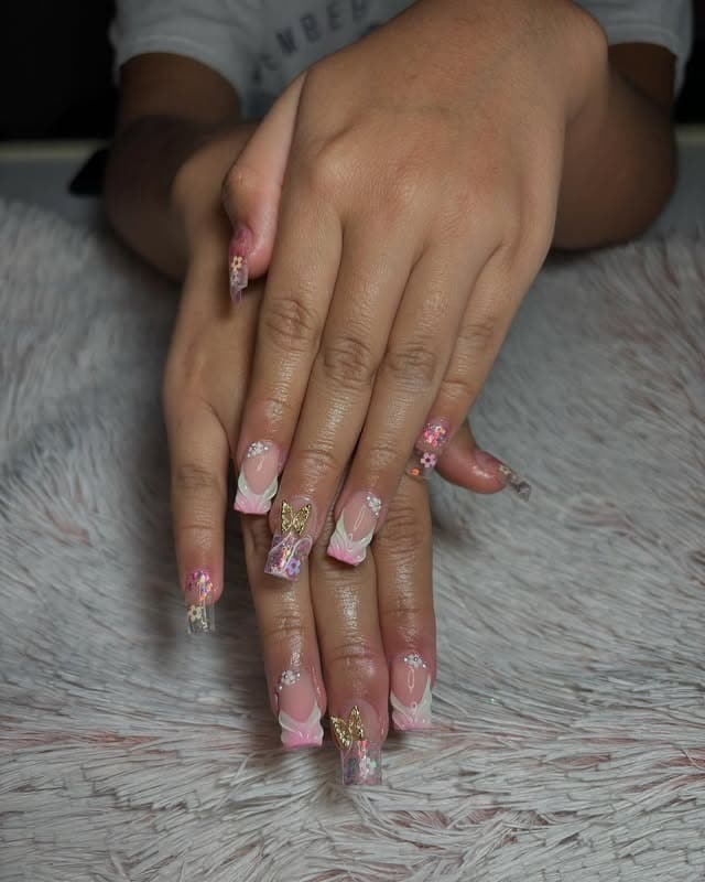 16. Long Coffin Pink Glitter and Butterfly Accent Nails - school nail ideas