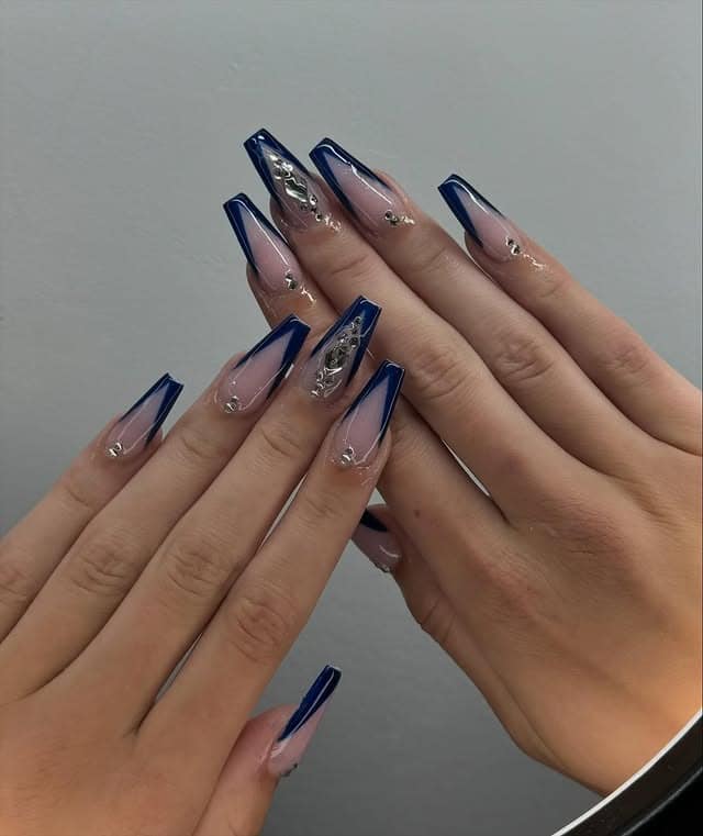 21. Long Coffin Nude and Navy Blue V-French with Rhinestones - school nail ideas