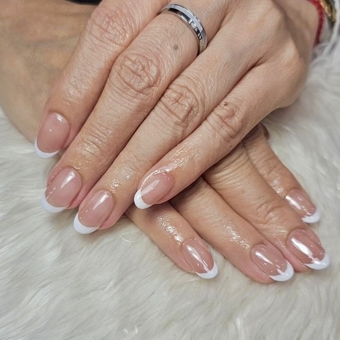4. Traditional French Tip Oval Nails - old money nail ideas