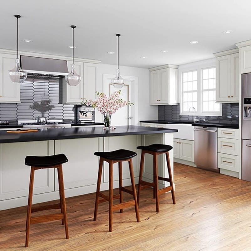 2. Cream Cabinets with Bold Black Countertops - cream kitchen cabinet ideas