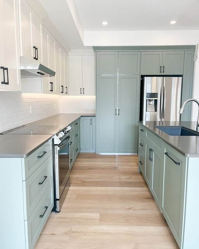 3. Soft Cream and Sage Two-Tone Kitchen - cream kitchen cabinet ideas