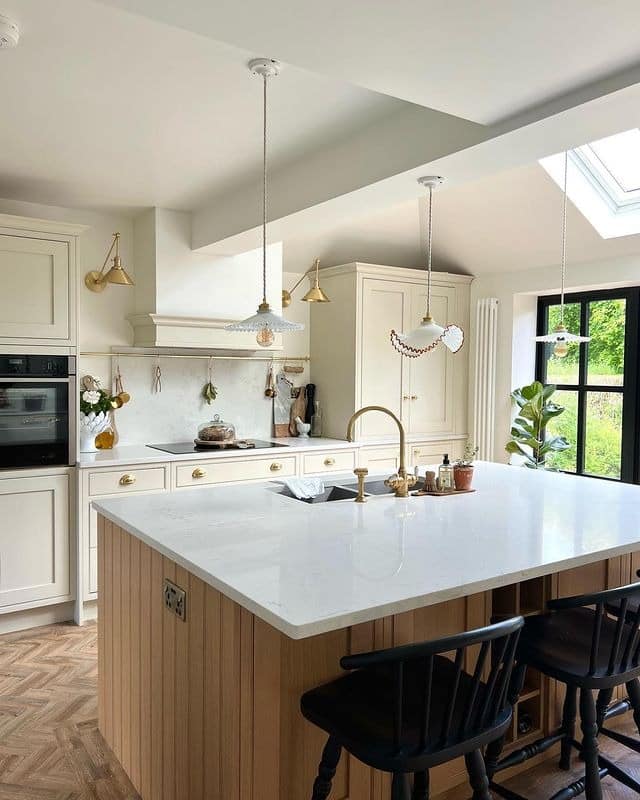 7. Traditional Cream Kitchen with Natural Wood Island - cream kitchen cabinet ideas