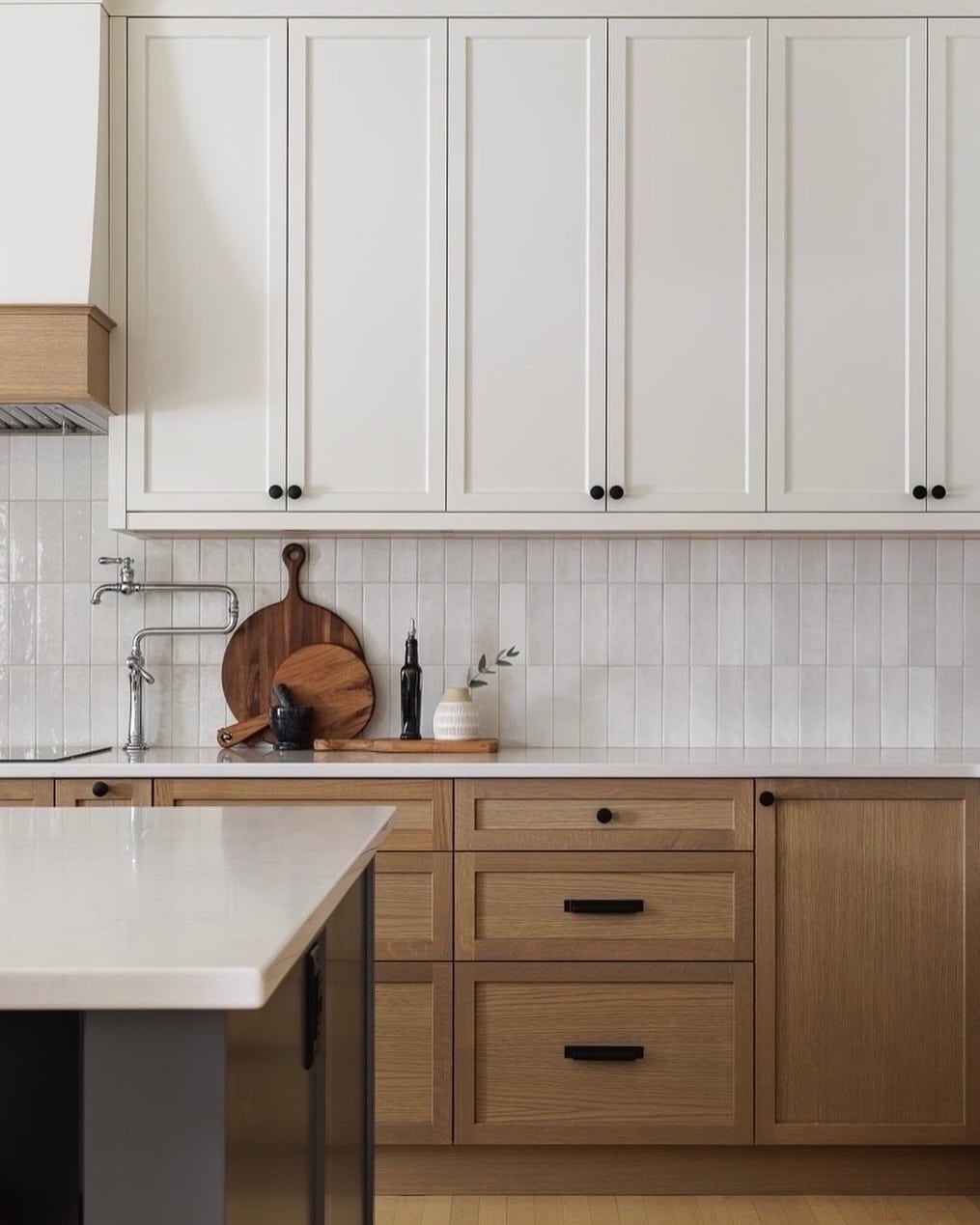 21. Cream Upper Cabinets with Natural Oak Base Contrast - cream kitchen cabinet ideas