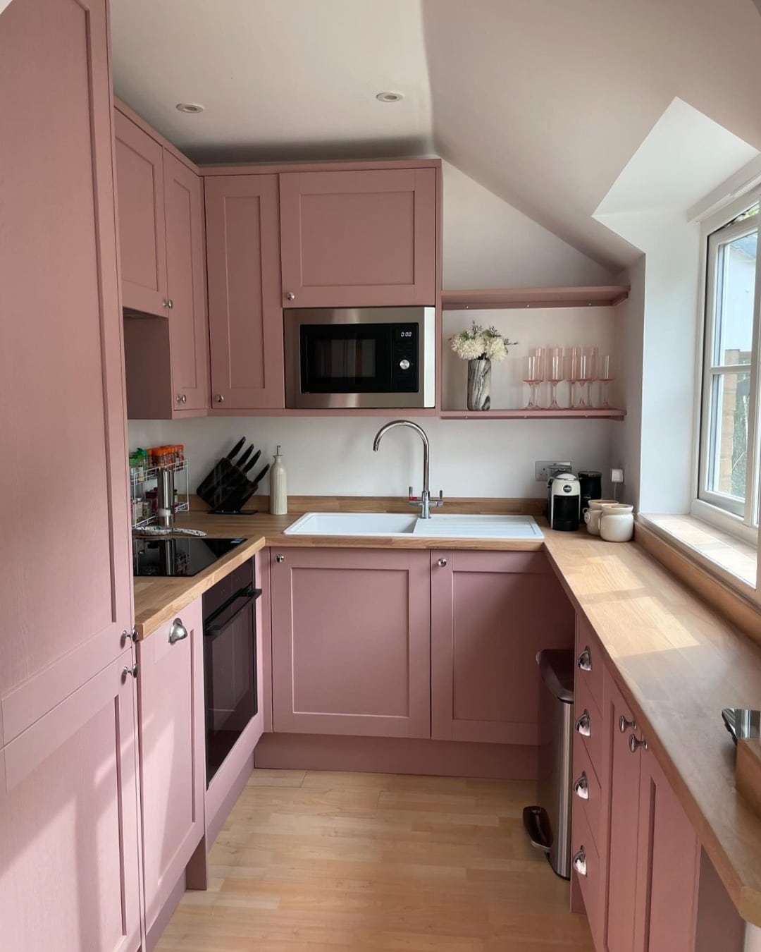 1. Blush Pink Cottage Kitchen with Warm Wood Accents - pink kitchen ideas