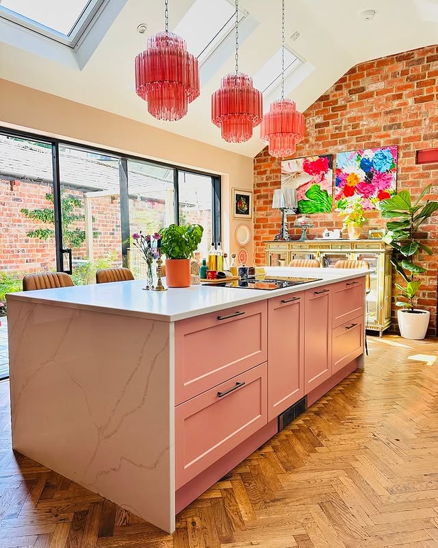 14. Peach Pink Island Kitchen with Industrial Brick Backdrop - pink kitchen ideas