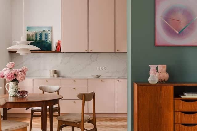 17. Pale Pink Kitchen with Mid-Century Dining Integration - pink kitchen ideas