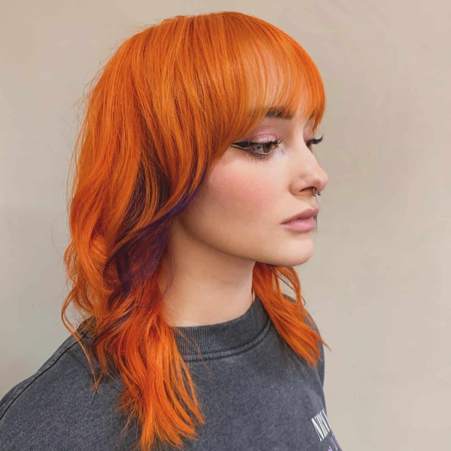 10. Vibrant Copper Wolf Cut with Blunt Fringe - Wolf Haircut