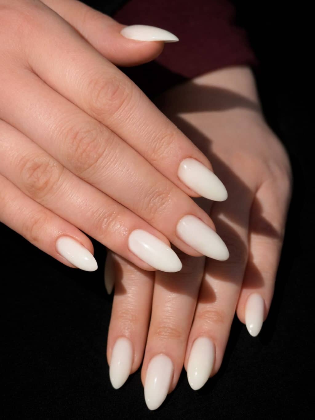3. Glossy Milky White Almond Nails - white nail ideas